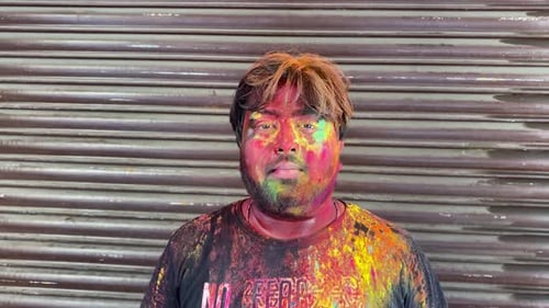 Man Celebrates Holi Festival Covered in Colorful Powder