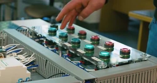 Pushing green and red buttons on a controler.
