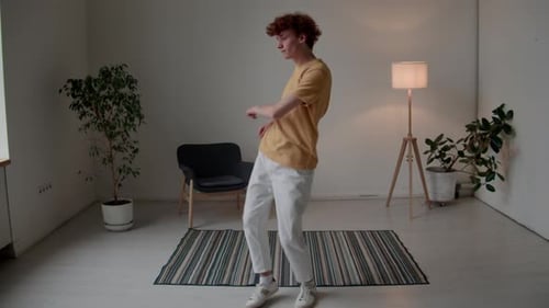 Carefree Guy Dancing at Home Alone