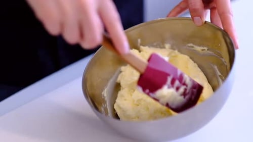 Butter Being Mixed in Silver Bowl