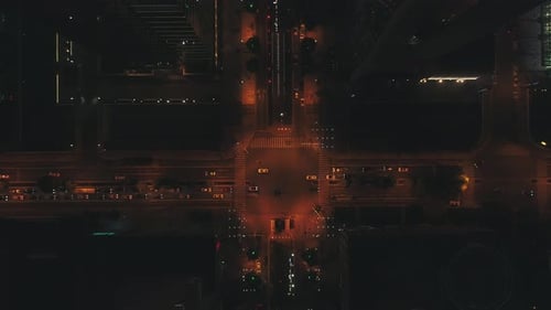 Aerial Drone Top View of Night City Road Traffic Over Big Crossroad Cars and Buses Driving By Avenue