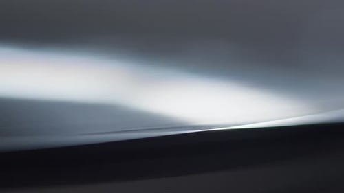 shot of the needle of a record player as it plays a record, then stops and starts again in a loop.