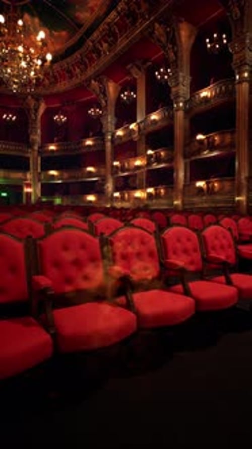 Vibrant Red Seats Await Opera Lovers in an Elegant Theater Space