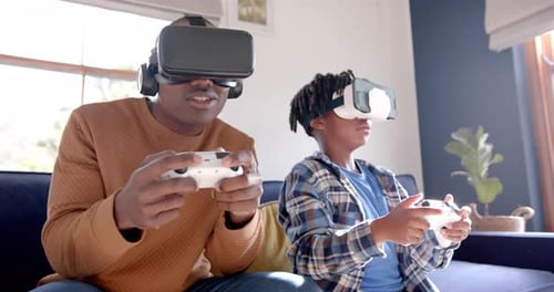 Father and Son Enjoying Virtual Reality at Home