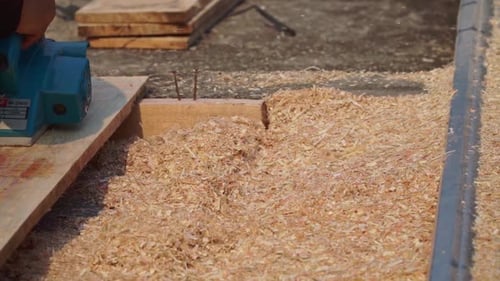 Modern Planer Smoothing Wood in Workshop