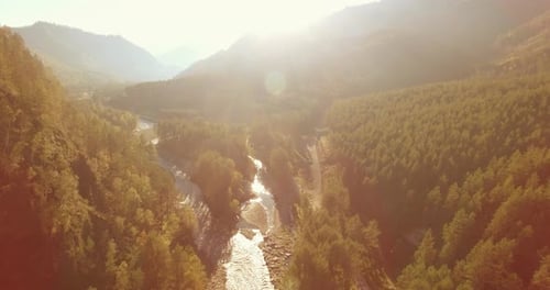 Low Altitude Flight Over Fresh Fast Mountain River with Rocks at Sunny Summer Morning