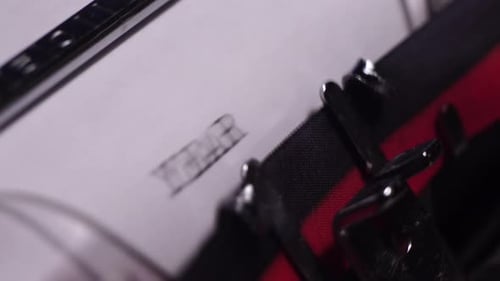 Year 1971, Typing in Vintage Typewriter on Blank White Paper, Close Up