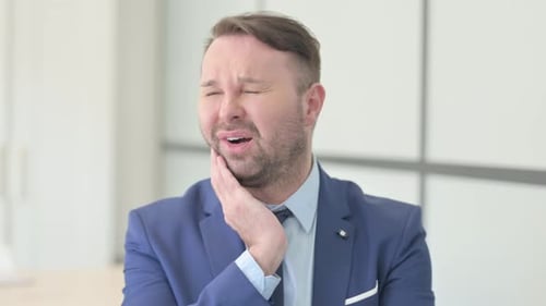Portrait of Businessman having Toothache, Tooth infection