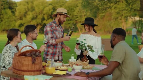 Friends Gather for Picnic in Grassy Park