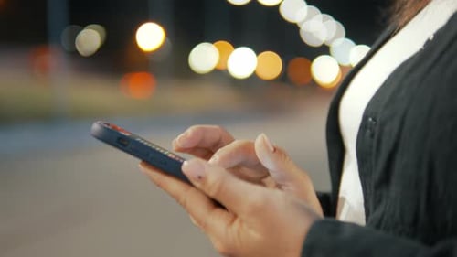Close Up of an Young Woman Hands are Using a Smartphone Phone for Send Messages