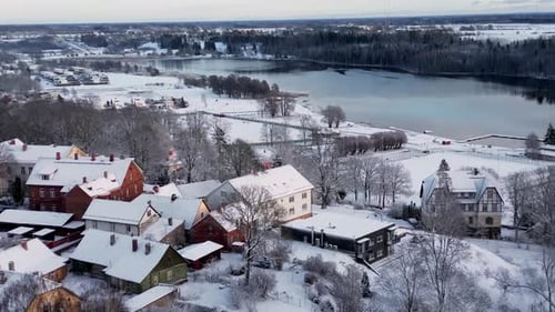 Quaint Village Covered in Snow Aerial View