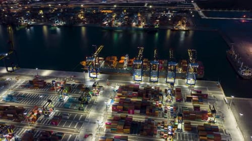 Aerial View of Busy Container Cargo Port at Night