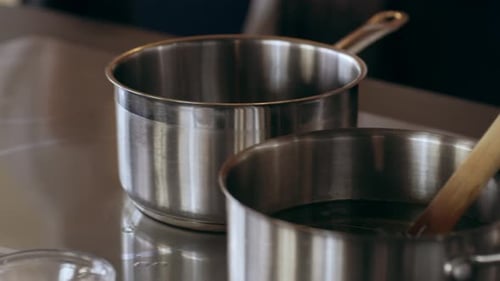 Pan of Work Station with Pots, Pans, Bowls and Ingredients in Interior