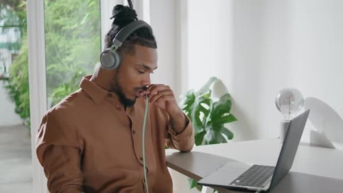 Young Adult Using Laptop During Video Call
