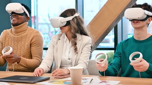 Business conference in VR in an office. Multiracial group of people using VR glasses and controllers