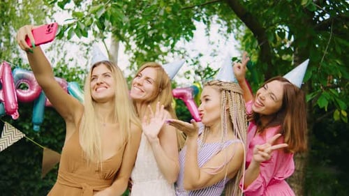 Young Women Celebrate Birthday With Selfie Outdoors