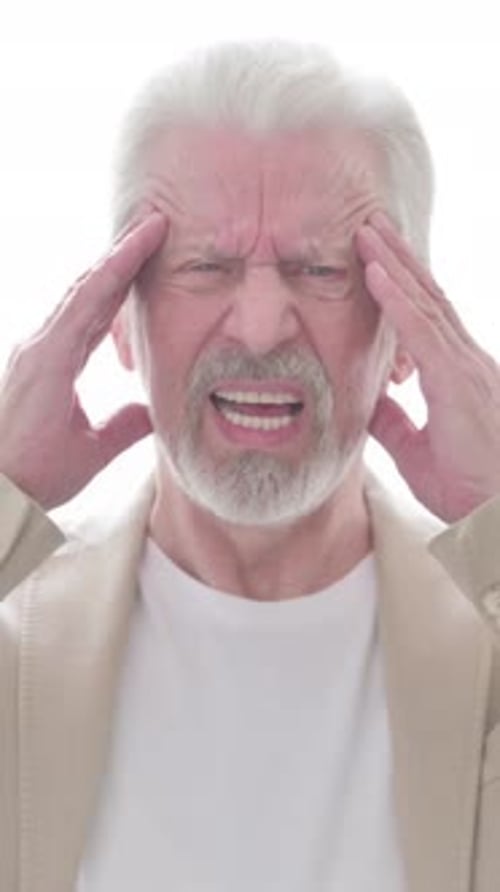 Senior Man Experiencing a Headache and Stress