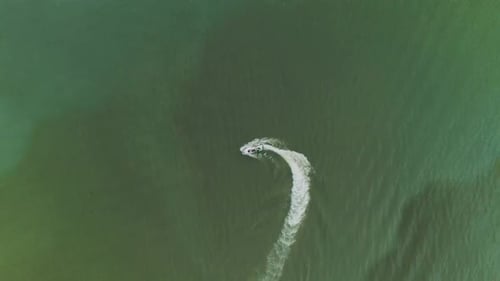 Aerial view of a jet-ski motorboat run in circle in Thailand.