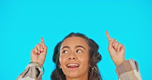 Woman, face and pointing, advertising with smile and product placement on blue background