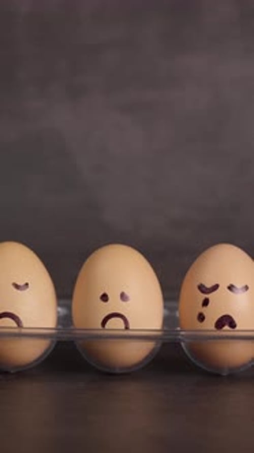 Sad Eggs in a Carton with Drawn Faces