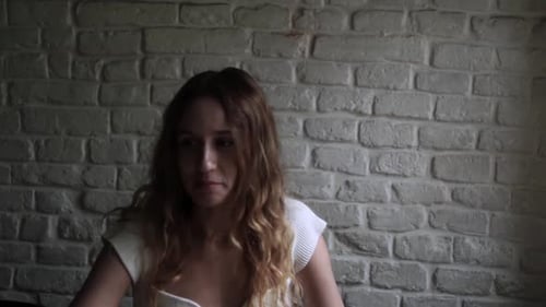 Young Woman Working on Her Laptop Computer in Coffee Shop