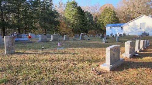 Flying over tombstones in a cemetary