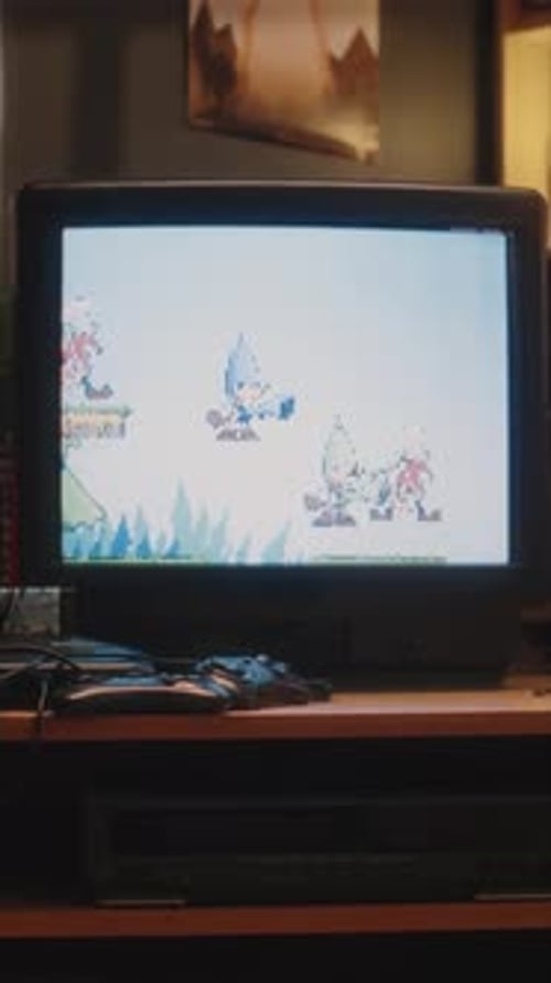 Vertical of Tube TV with Old Arcade Video Game on Screen at Home