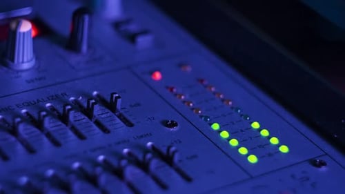 LED Indicator of Sound Level Signal on the Mixing Console in Neon Light CloseUp