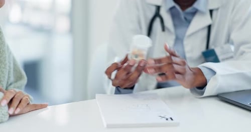 Doctor Writing Prescription at Clinic Visit