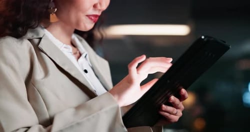 Night, woman and hands with tablet in office for investment, research and reading update on economy