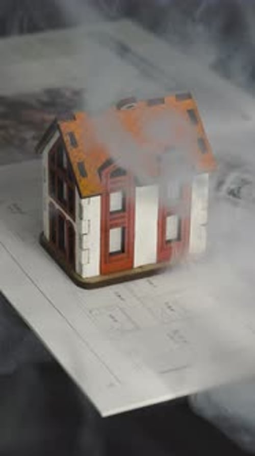 Miniature House Model with Smoke Effect on Blueprint