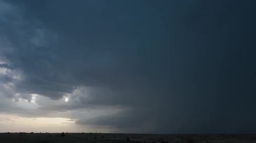 Storm Cloud with Lightning over Rural Field