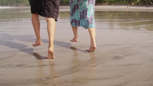 Couple Running on Beach, Closeup of Feet,