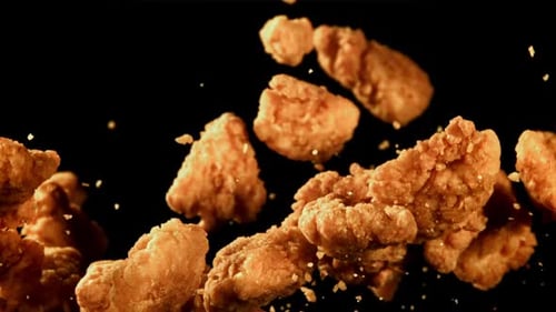 Delicious Crispy Fried Chicken Falling in Slow Motion