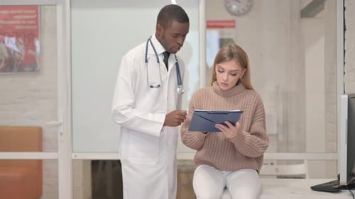 Female Patient Signing Documents Before Treatment in Clinic