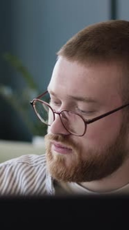 Man In Eyeglasses Working In Office