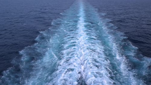 Huge ship leaving ship wake on the sea as it sails