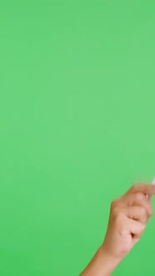 Hand Holding and Waving Small Flag on Green Screen