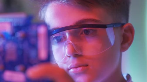 Close-up eyes of boy with high tech interest.