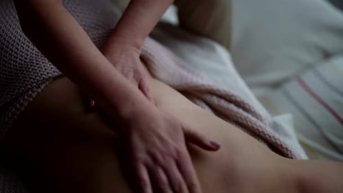 Traditional Massage in Thai Spa Salon Woman is Relaxing When Masseuses Stroking Her Back