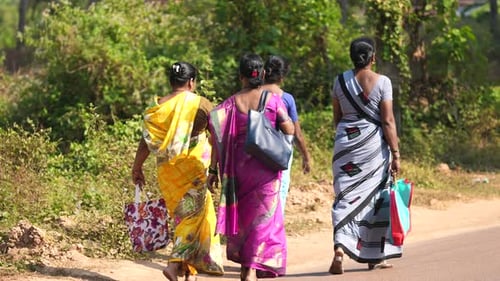 Local indian women stroll together. Female hindu wear national dress India Goa.