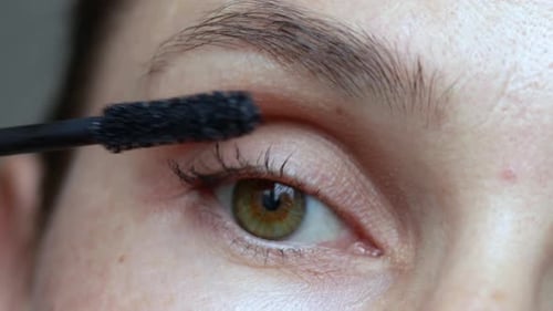 Close Up Applying Mascara to Eyelashes