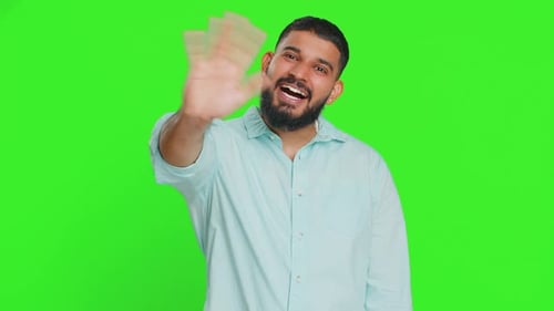Man Waving Hands in Front of Green Screen