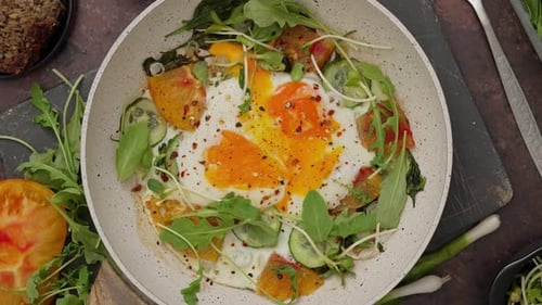 Eggs with Vegetables Cooking in Pan