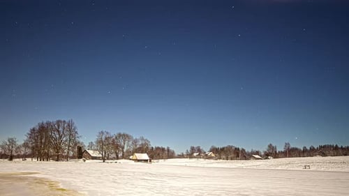Starry Winter Night in a Snow Covered Landscape