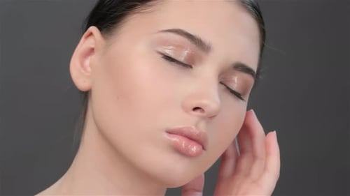 Woman with Wet Makeup Close Up