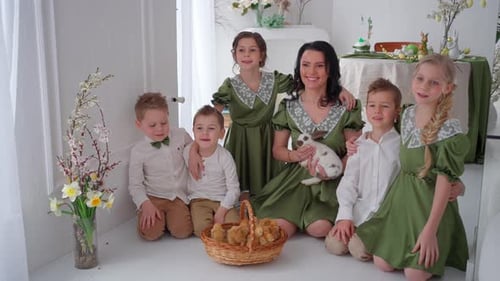 Happy Family in the Same Green Outfit Posing Easter Celebration Concept