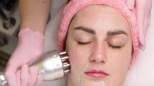 Woman Receiving Facial Treatment at a Spa
