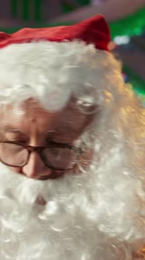 Vertical Video Saint Nicholas Prepares a Festive Gift Box By the Fire in Workshop