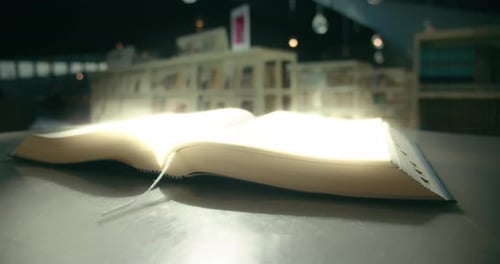 Glowing Pages of an Open Book Closeup Reading Knowledge Concept Cinematic Light at University